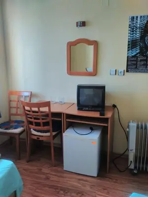 a desk with a laptop computer on top of it at Bonbon Guest House in Panagyurishte