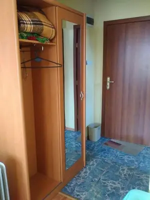 a room with a closet with a door and a floor at Bonbon Guest House in Panagyurishte