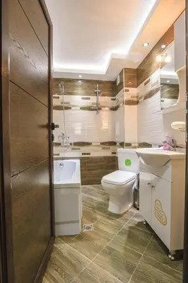 a bathroom with a toilet and a sink at Sundance Apartments in Sandanski