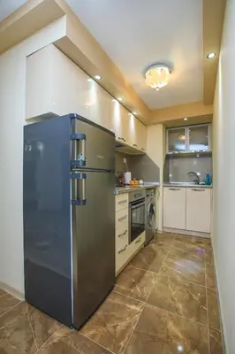 a large stainless steel refrigerator in a kitchen at Sundance Apartments in Sandanski