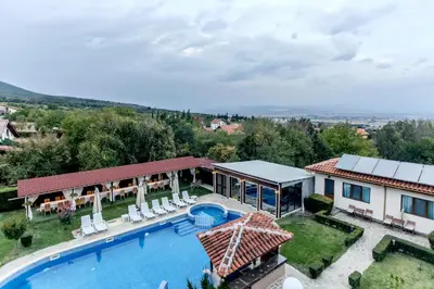 an aerial view of a house with a swimming pool at Вила Флора Паталеница in Patalenitsa