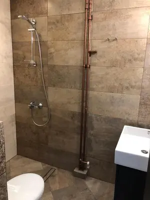 a bathroom with a shower with a toilet and a sink at Golden Dome view Apartment in Sofia