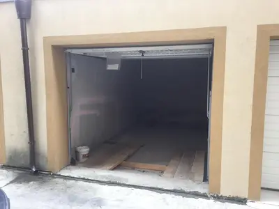 a garage with the door open in a building at Pirotska Apartment GN / FREE GARAGE in Sofia