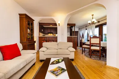 a living room with a couch and a table at The House With The Piano in Plovdiv