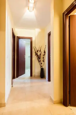 a hallway with a vase of flowers in a room at Ibar Apartment & Garage in Plovdiv