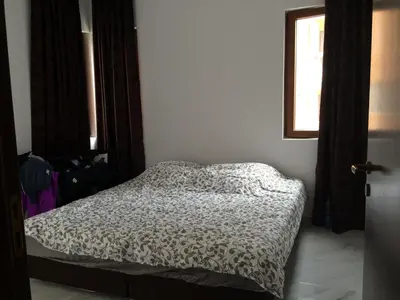 a bedroom with a bed and a window at Apartment Spa Holidays in Sandanski