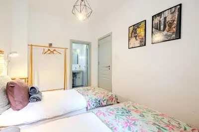 a bedroom with a bed and a mirror at Casa Dolce Far Niente, 2BATH&2BED, PARKING, Vitosha blvd in Sofia