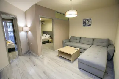 a living room with a couch and a table at Apartments KiM Sandanski in Sandanski