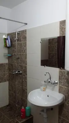 a bathroom with a sink and a shower at Rooms Lagat in Troyan