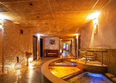 a room with a pool in the middle of a building at Balneo Complex & Spa Aquatonik in Velingrad