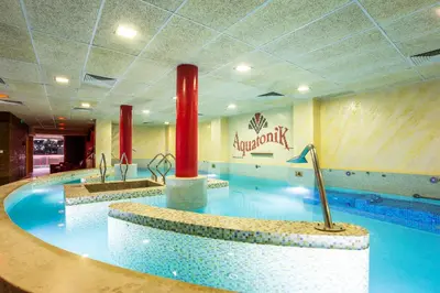 a large swimming pool with two sinks at Balneo Complex & Spa Aquatonik in Velingrad