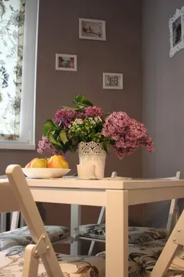 a table with a vase of flowers on top of it at Yavor Apartment in Sofia