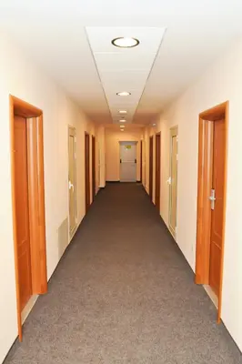 an empty hallway in an office building at Hotel Astra in Sofia