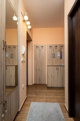 a row of wooden lockers in a dressing room at MIDAS - Borov Park in Velingrad