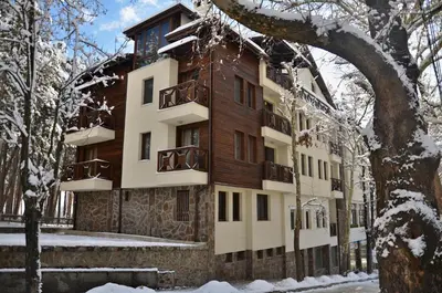 an apartment building in the winter with snow at MIDAS - Borov Park in Velingrad