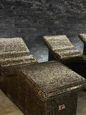 three wicker baskets sitting next to a brick wall at Grand Hotel Murgavets in Pamporovo