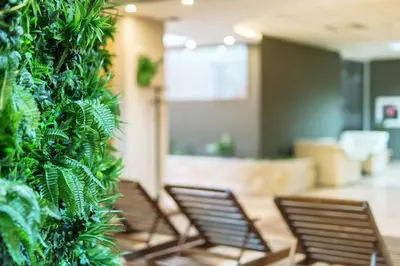 a row of chairs in a room with plants at Devin Spa Hotel in Devin