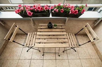 an overhead view of a table and chairs with flowers at Sofia City Home in Sofia