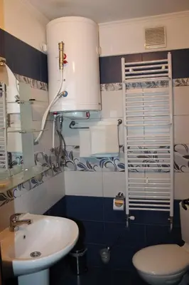 a bathroom with a sink and a toilet at Guest House Maria in Koprivshtitsa