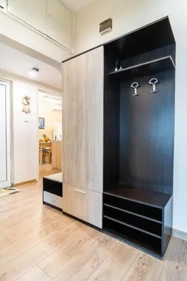 a room with a large black and wooden wall at Madrid 90 Sq M 2BDR w Parking Spot near Metro, Serdika Mall in Sofia