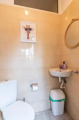 a bathroom with a toilet and a sink at Madrid 90 Sq M 2BDR w Parking Spot near Metro, Serdika Mall in Sofia