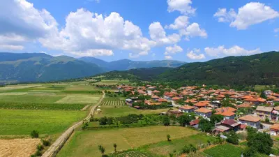 an aerial view of a village in the mountains at Georgievi Guest House in Kalofer