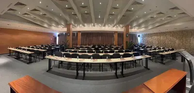 a conference room with a large table and chairs at Park Hotel Sankt Peterburg in Plovdiv