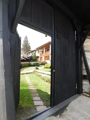 an open door of a building with a yard at Family Vacation Home Topolnitza in Koprivshtitsa