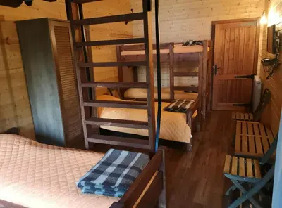 a room with bunk beds in a cabin at PinusVillas Private Jacuzzi & Phyto-Sauna in Zheleznitsa