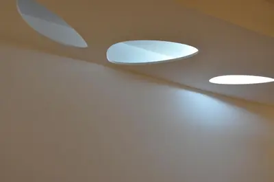 two lights on the ceiling of a room at Architectural City Loft in Sofia