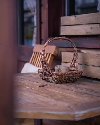 a wicker basket sitting on top of a wooden table at Hotel Orbel in Dobrinishte