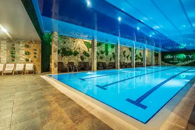 a large swimming pool in a building at SPA Hotel Infinity Park Velingrad in Velingrad