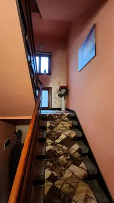 a staircase in a house with a stone floor at Guest House PIP in Velingrad