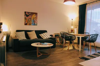 a living room with a couch and a table at Apartments 18 in Velingrad