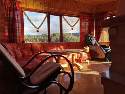 a living room with a couch and a table at Guest House Milka in Yagodina
