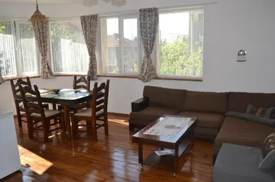 a living room with a couch and a table at Vila Venera in Velingrad