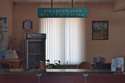 a restaurant with a sign that reads pelikan reception at Hotel Jeravna in Bankya