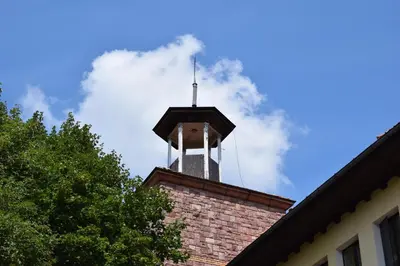 a tower on top of a brick building with a antenna at Hotel Jeravna in Bankya
