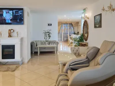 a living room with couches and a fireplace at Hotel Dalia - Bankya in Bankya