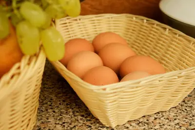 two baskets of eggs sitting on a counter at Family Hotel EDI in Sofia
