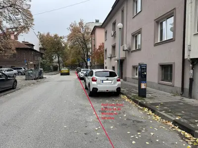 a car parked next to a parking meter on a street at Apartment Trimontium in Plovdiv