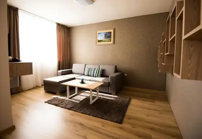 a living room with a couch and a table at Court Inn in Panagyurishte