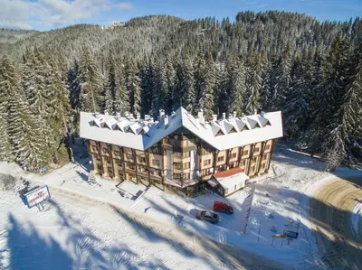an aerial view of a resort in the snow at Effect Malina Residence Hotel in Pamporovo