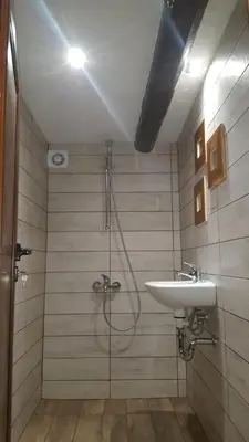 a bathroom with a shower and a sink at Pisanata House in Dedovo