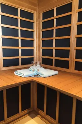 a table with wine glasses and a napkin at Planinski Polah House in Devin