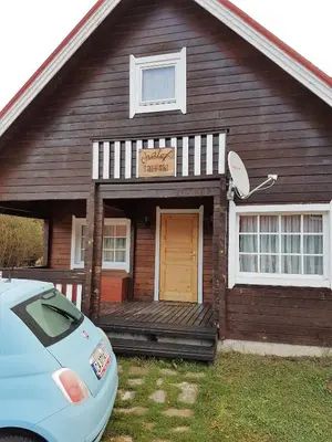 a house with a car parked in front of it at Chalet Taffski in Borovets