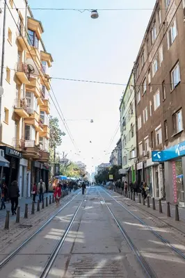 an empty city street with people walking on the street at Graf Ignatiev - 3BR APART in Sofia