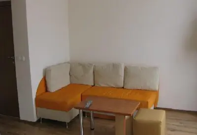 a couch in a living room with a coffee table at The Castle Hotel in Samokov