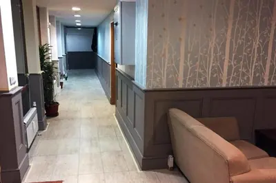 a hallway with a waiting room with a couch at Mountain View Resort Studio in Bansko