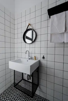 a white bathroom with a sink and a mirror at Mouse House Kapana in Plovdiv